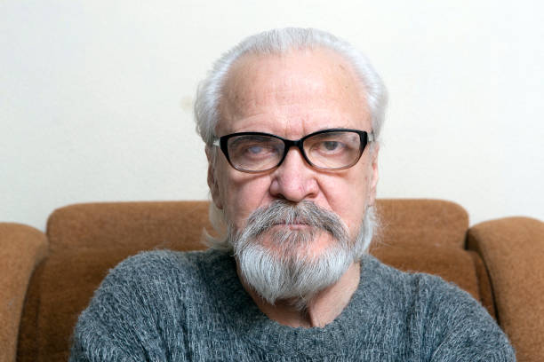 istock Lonely old man with sore eyes 984846920