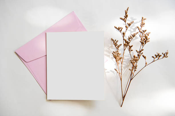 istock Blank white greeting card with envelope and flower. for mockup template. vintage tone. 984847208