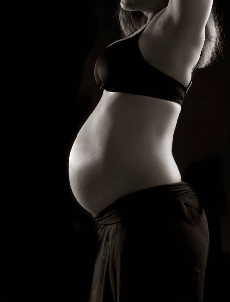istock young woman with baby belly 984849604