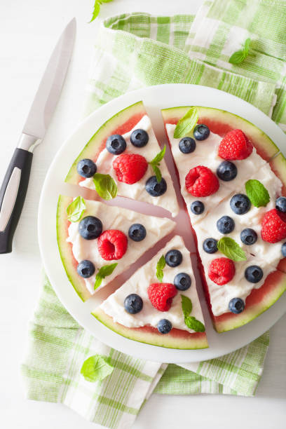 istock watermelon pizza slices with yogurt and berries, summer dessert 984849684
