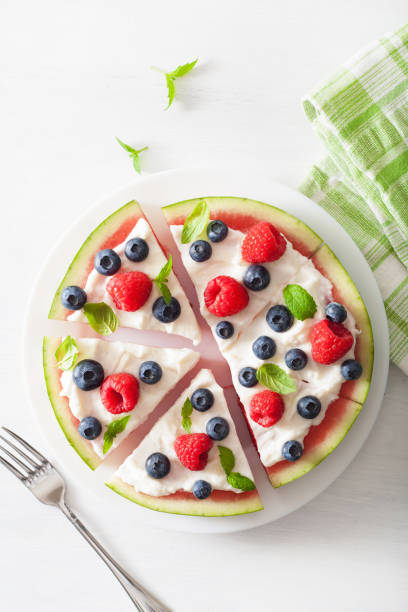 istock watermelon pizza slices with yogurt and berries, summer dessert 984850416