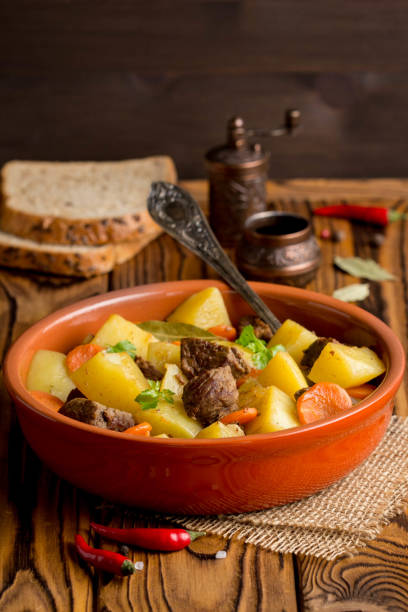 istock Beef stew with vegetables potatoes, carrots, delicious autumn dish, gravy 984864864