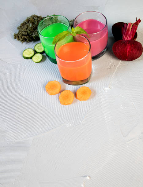 istock Healthy vegetable smoothie and juice on light backround 984879004