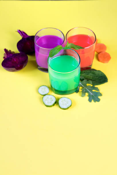istock Healthy vegetable smoothie and juice on yellow backround 984879008