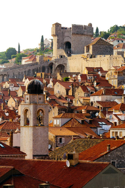 Bell tower, Minceta tower and houses with red tiles in Dubrovnik, Croatia Bell tower, Minceta tower and houses with red tiles in Dubrovnik, Croatia. fort minceta dubrovnik stock pictures, royalty-free photos & images