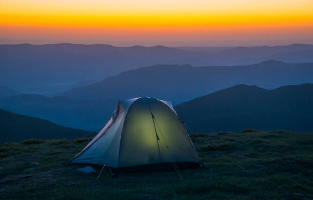 istock Tourist tent in mountains 984960572