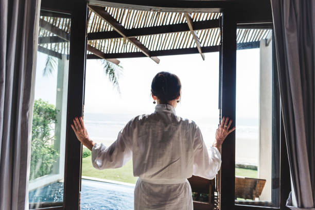 istock Mature woman in a bathrobe at a resort 984962040