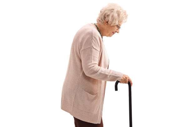 istock Elderly woman with a cane 984962588