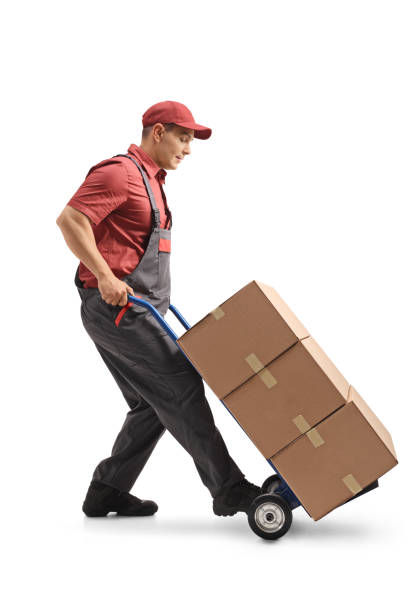 istock Mover with a hand truck loaded with cardboard boxes 984963496