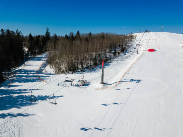 istock Active leisure and winter entertainment. Skiers and snowboarders 984965982