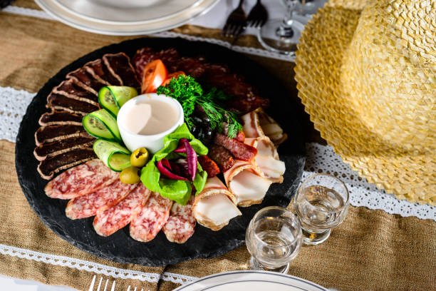 istock Appetizing meat set: beef slices, bacon, salami and vegetables o 984967024