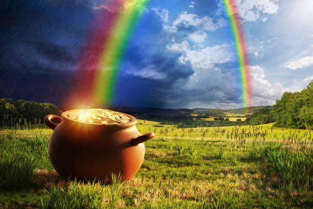 Rainbow Pot of Gold Pot full of gold at the end of the rainbow. cauldron photos stock pictures, royalty-free photos & images
