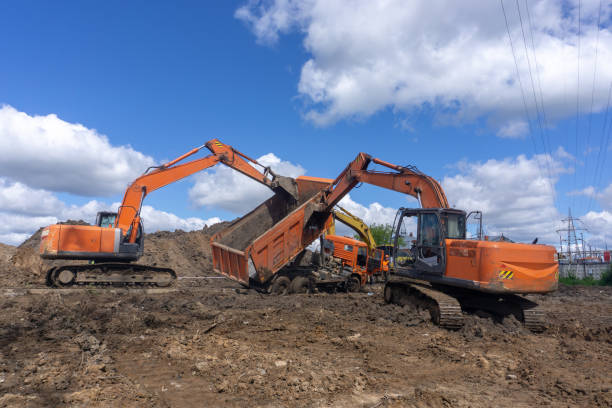 istock Inverted truck is lifted by excavators 984972364