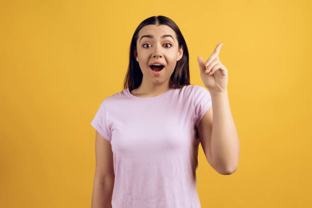 istock Young enthusiastic girl is standing 984973346