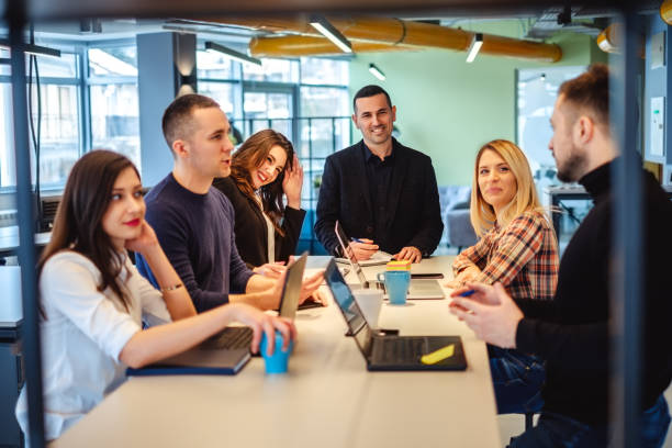 istock Colleagues looking at one man at the office meeting 984978618