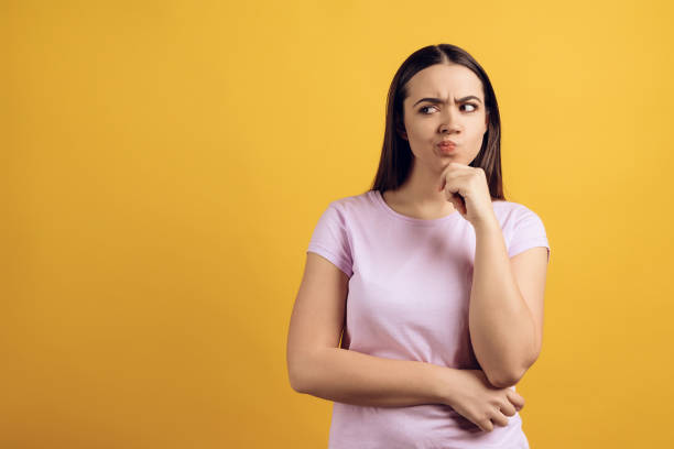 istock Young thoughtful girl is thinking about something. 984978908