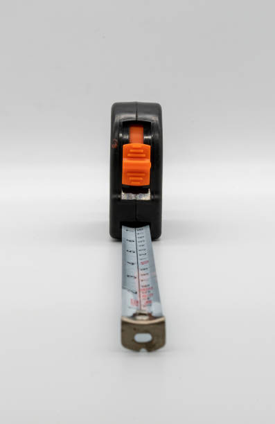 istock Black and grey measuring tape isolated on white background. 984982910