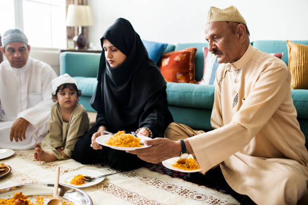 istock Muslim family having dinner on the floor 984988130