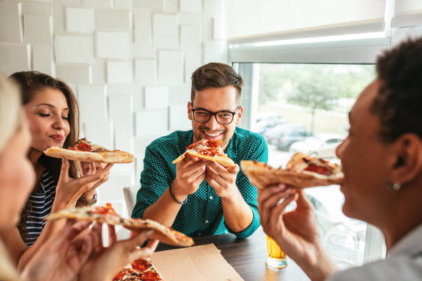 istock Tucking into some great food 984990038