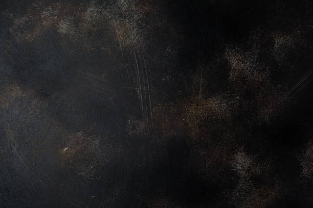 istock Dark brown stone or slate wall. Grunge texture background. 984994640