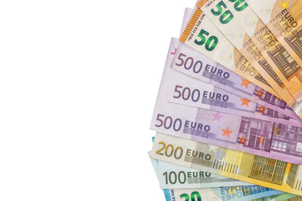 istock Euro banknotes isolated on white background, top view 984999298