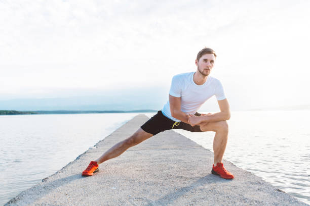 istock Young man stretching before the morning run 985001466
