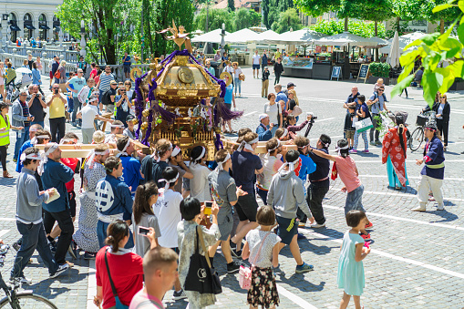 Ljubljana, Slovenia - Jun 23, 2018:The Portable Shrine Mikoshi shrine on the central square of Ljubljana during Japan day festival, SloveniaThe festival is the first in Ljubljana, Slovenia, next to Berlin in Germany and Montréjeau in France. Portable Mikoshi shrine is brought from the Japanese Kasuga Shrine and is located in Europe. Local people and some Japanese carry the portable shrine (mikoshi) in the streets to bring good fortune to local businesses and residents.