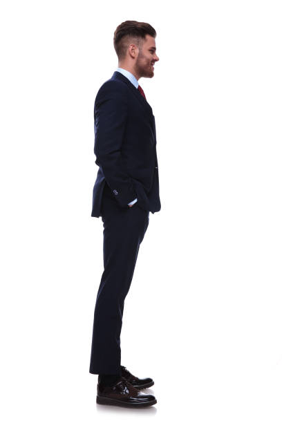istock businessman with hands in pockets waiting in line 985002342