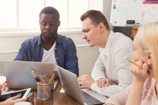 istock Concentrated business people working at office 985008244
