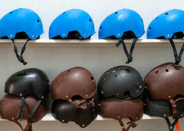 istock extreme sport helmets on the shelf 985013540