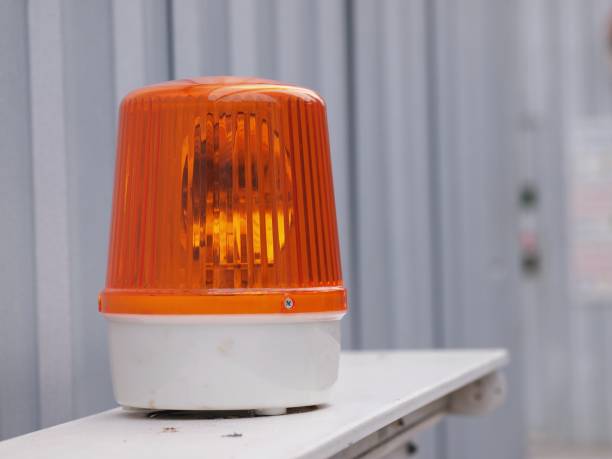 istock orange siren light in construction side  on safety sign 985013564