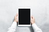 Hands holding blank vertical tablet mock up