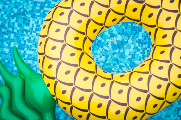 istock Life ring pineapple In the pool summer 985017072