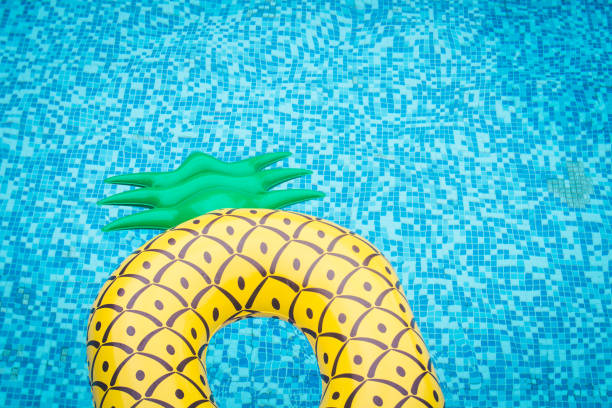 istock Life ring pineapple In the pool summer 985017220