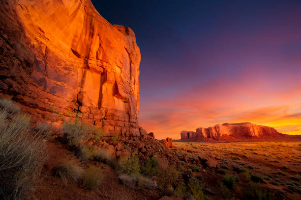 Spectacular Sunrise in Monument Valley Stunning sunrise under a dramatic sky in Monument Valley, AZ red rocks landscape stock pictures, royalty-free photos & images