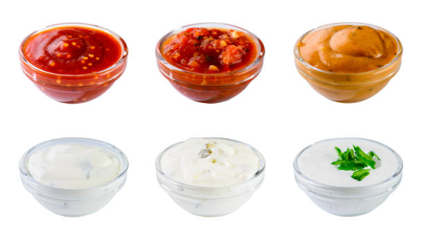 istock Set of different delicious sauces for dishes isolated on white b 985024258