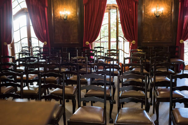istock Empty rows of chairs in a church 985024422