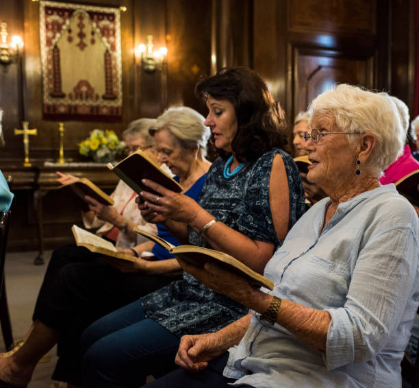 istock Congregation singing together in church 985024638