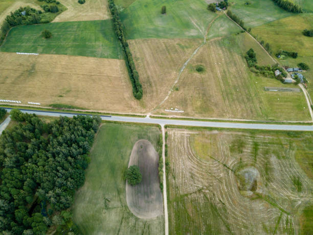istock drone image. aerial view of rural area with fields and forests 985025064