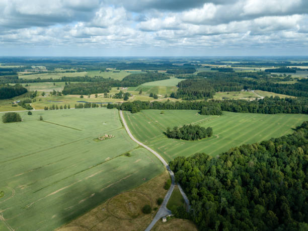 istock drone image. aerial view of rural area with fields and forests 985025200