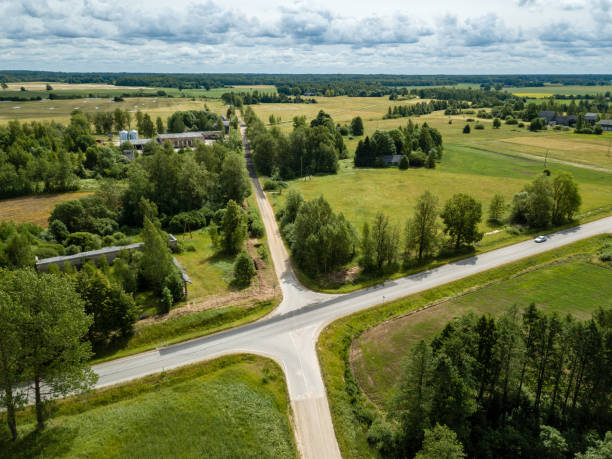 istock drone image. aerial view of rural area with fields and road network 985025234