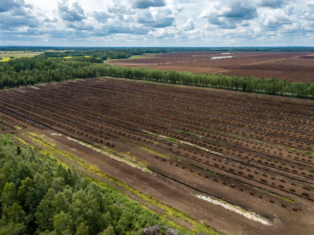 istock drone image. aerial view of rural area with fields of turf development 985025414
