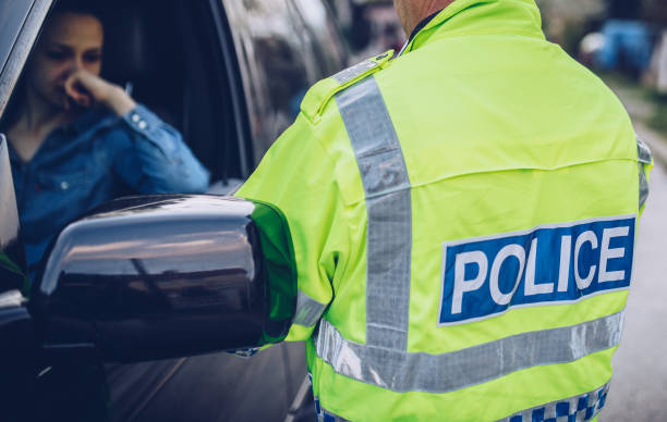 istock Woman pulled over by traffic police 985025434