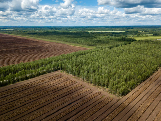 istock drone image. aerial view of rural area with fields of turf development 985025456