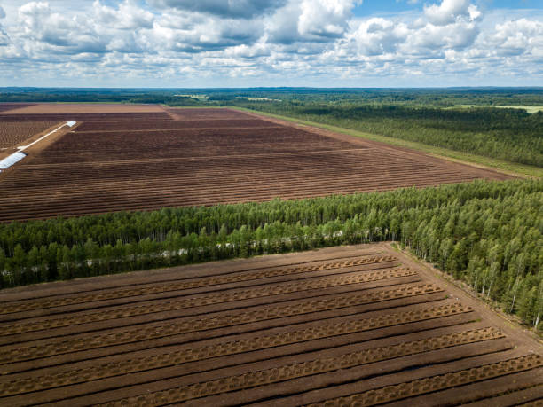 istock drone image. aerial view of rural area with fields of turf development 985025494