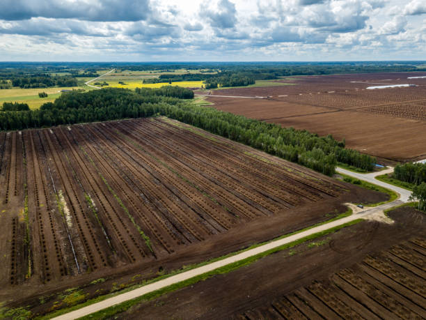 istock drone image. aerial view of rural area with fields of turf development 985025588