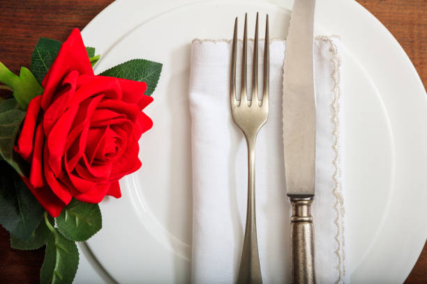 istock Valentine's day romantic place setting on wooden background 985025606