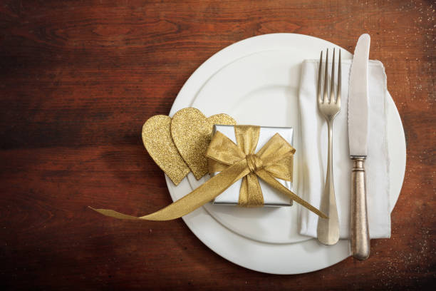 istock Valentine's day romantic place setting on wooden background 985028188