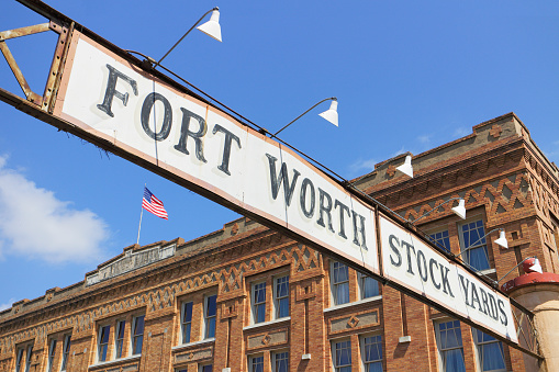 Sign at the entrance to the Fort Worth Stockyards - a historic district that is located in Fort Worth, Texas.Listed on the National Register as a historical district (c. 1976), the Stockyards consist of entertainment and shopping venues and celebrates the long tradition of the cattle industry in Fort Worth.