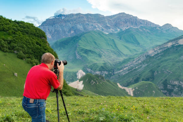 istock Nature photographer take shot in mountains 985032448